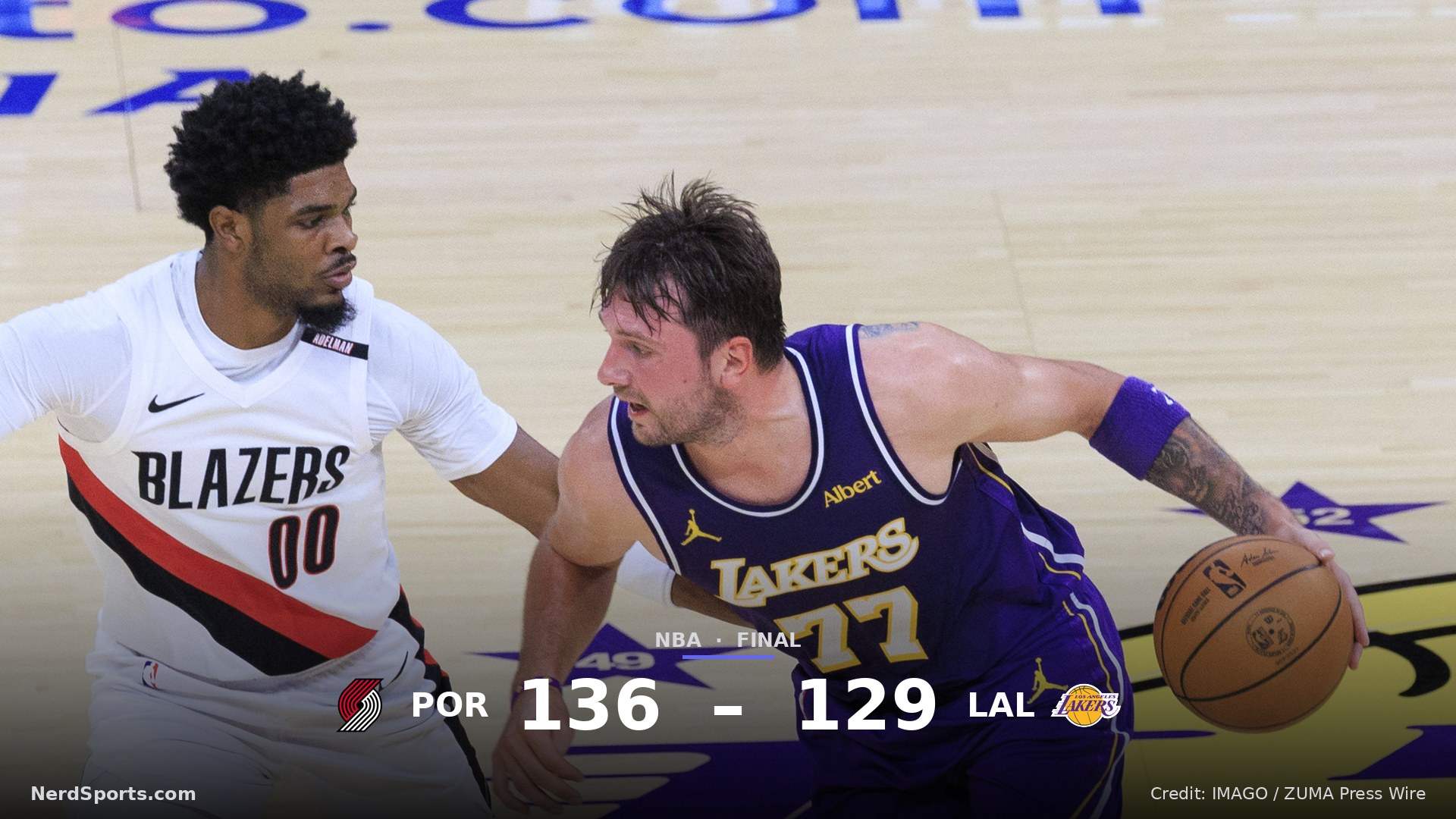 Luka Doncic 77 of the Los Angeles Lakers drives past Scoot Henderson 00 of the Portland Trail Blazers during their regular season NBA game on Tuesday October 27, 2026.